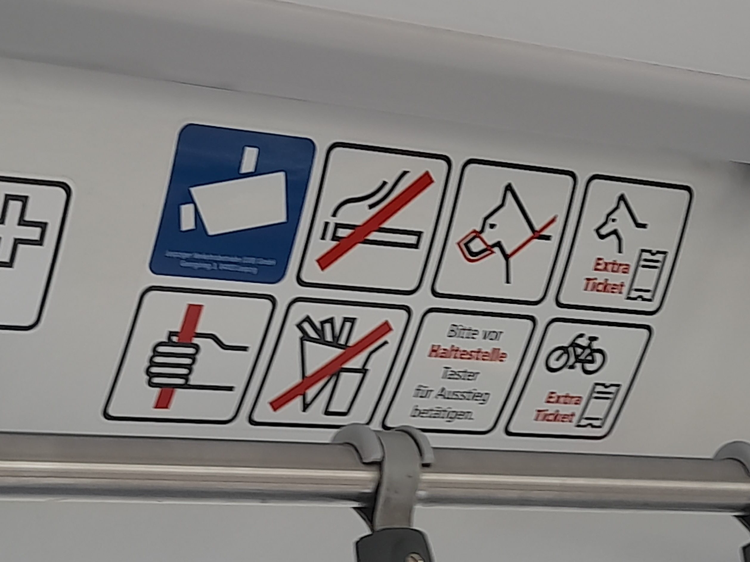 Icons and signs explain rules on the bus 